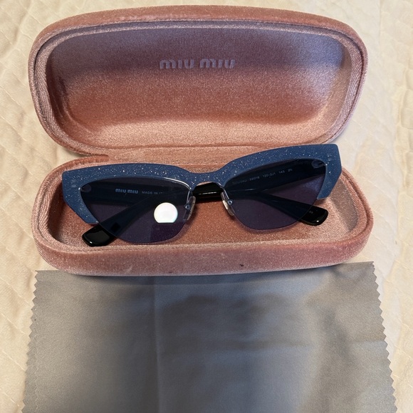 Miu Miu Women's Sunglasses Cat Eye Design